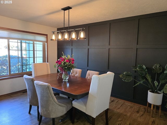 dining area with dark hardwood / wood-style floors