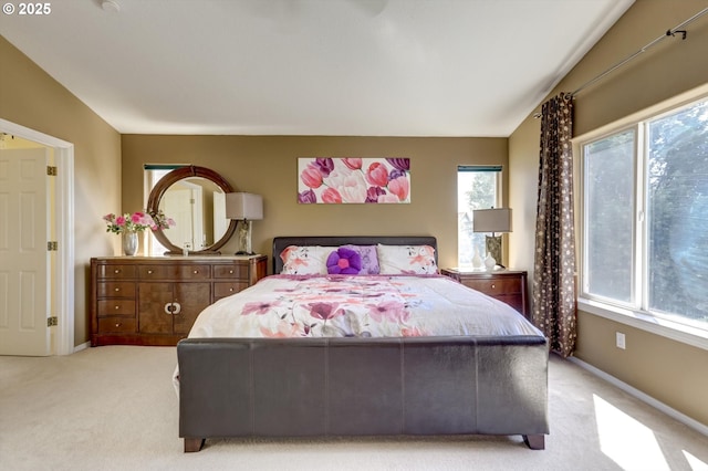 15463 NW Andalusian Way, Portland, OR 97229 - bedroom featuring light carpet, multiple windows, and baseboards