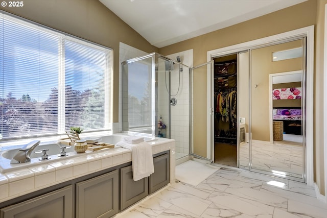 15463 NW Andalusian Way, Portland, OR 97229 - full bath with a shower stall, a walk in closet, and marble look tiles
