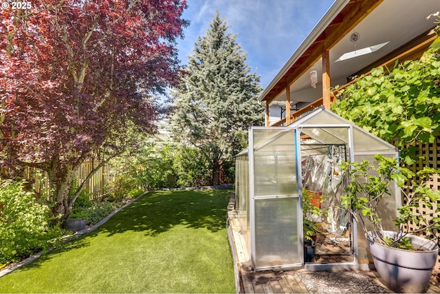 15463 NW Andalusian Way, Portland, OR 97229 - view of yard featuring a greenhouse and an outdoor structure