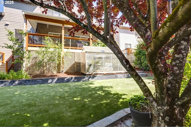 15463 NW Andalusian Way, Portland, OR 97229 - back of property with an exterior structure, an outbuilding, a lawn, and a deck