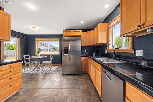 1313 Wakeman Ln, Gearhart, OR 97138 - kitchen with appliances with stainless steel finishes, a sink, plenty of natural light, recessed lighting, and baseboards