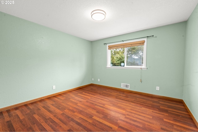 1313 Wakeman Ln, Gearhart, OR 97138 - empty room with wood finished floors and baseboards