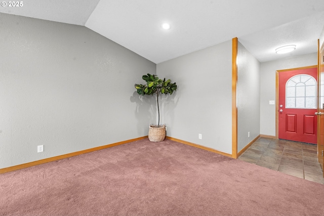1313 Wakeman Ln, Gearhart, OR 97138 - carpeted foyer entrance with vaulted ceiling and baseboards