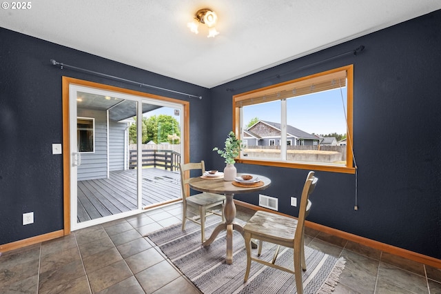 1313 Wakeman Ln, Gearhart, OR 97138 - dining room featuring baseboards and a textured wall