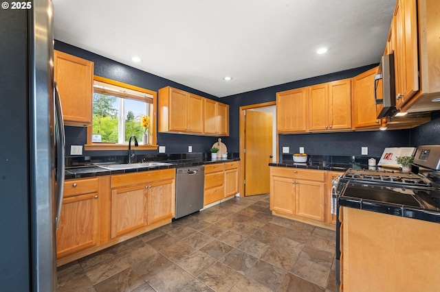 1313 Wakeman Ln, Gearhart, OR 97138 - kitchen with appliances with stainless steel finishes, a sink, dark stone finish floors, and recessed lighting