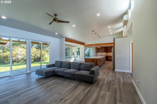 760 Carter St SW, Bandon, OR 97411 - living room with vaulted ceiling, recessed lighting, a ceiling fan, dark wood finished floors, and baseboards