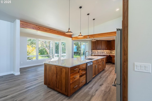 760 Carter St SW, Bandon, OR 97411 - kitchen featuring a sink, appliances with stainless steel finishes, light wood finished floors, plenty of natural light, and recessed lighting