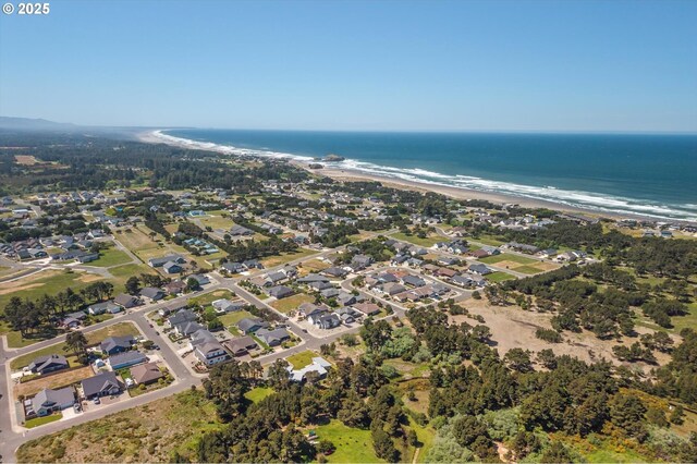 760 Carter St SW, Bandon, OR 97411 - aerial view of property and surrounding area with waterfront with a beach and nearby suburban area