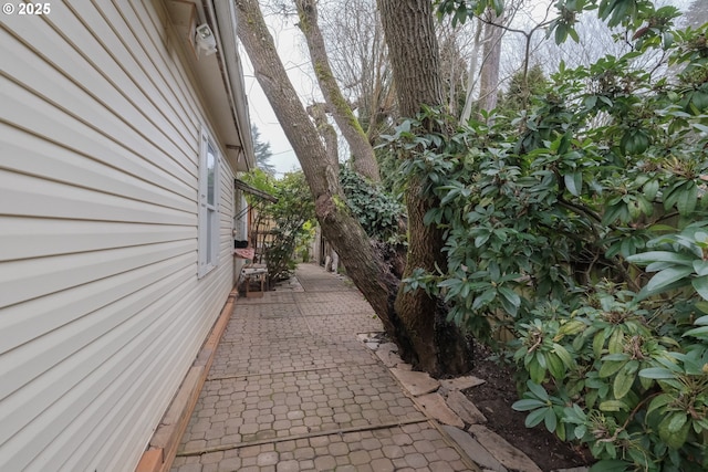 view of side of property with a patio area