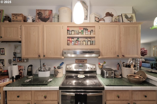 kitchen featuring stainless steel range with electric stovetop, tile countertops, and light brown cabinets