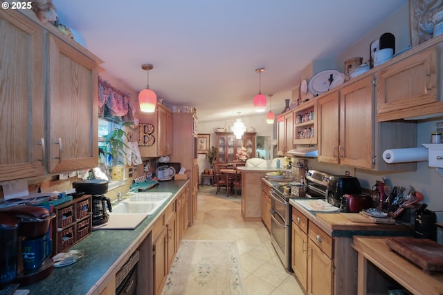 kitchen featuring double oven range, light tile patterned floors, hanging light fixtures, and wooden counters