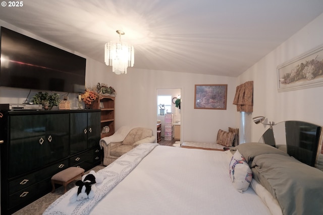 bedroom with a notable chandelier and ensuite bath