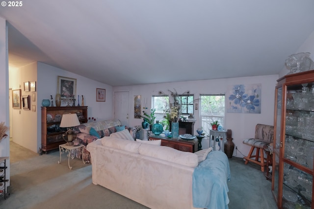 living room featuring lofted ceiling and light colored carpet