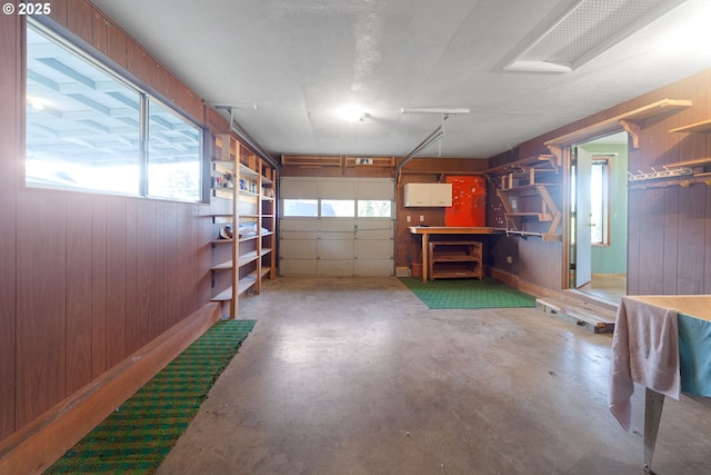 garage featuring wood walls