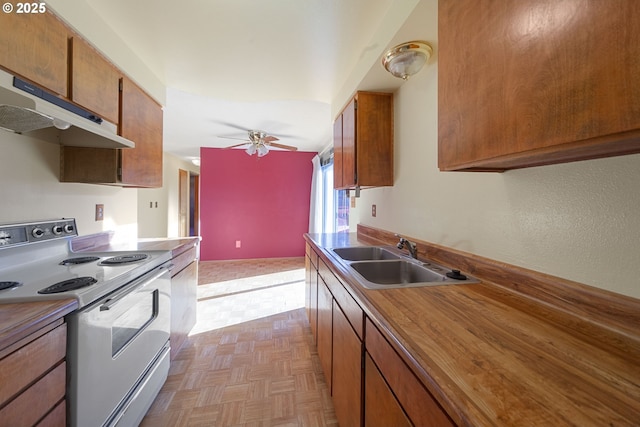 kitchen with sink, ceiling fan, white range with electric stovetop, and light parquet flooring