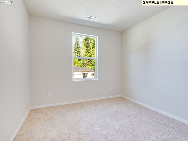 2133 NE 4th Ave, Battle Ground, WA 98604 - carpeted spare room featuring baseboards