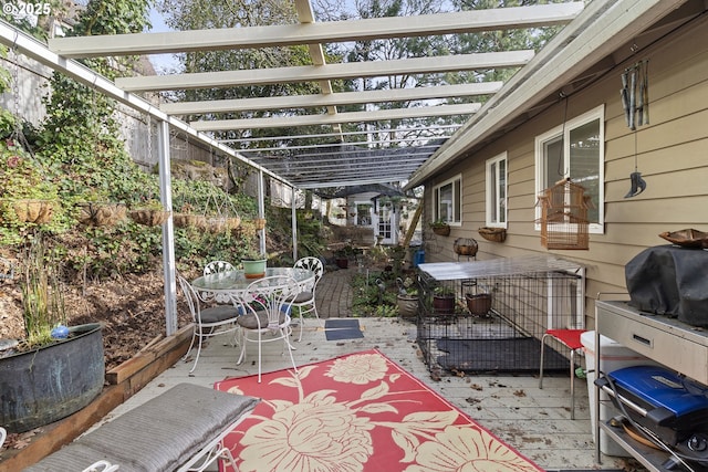 view of patio / terrace with a wooden deck, a pergola, and grilling area