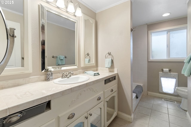 full bathroom with tile patterned flooring, ornamental molding, tiled shower / bath combo, vanity, and toilet