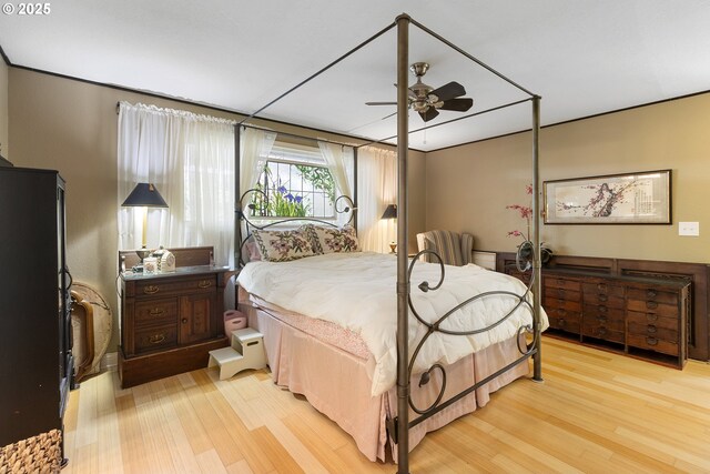 bedroom with ceiling fan and light wood-type flooring