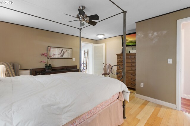 bedroom featuring light hardwood / wood-style flooring and ceiling fan