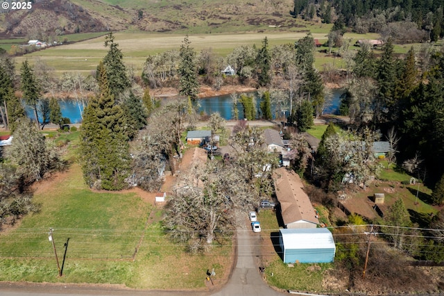 aerial view with a water view and a rural view