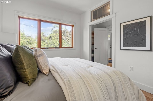 bedroom featuring baseboards