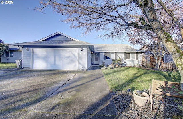 ranch-style home with a garage and a front lawn