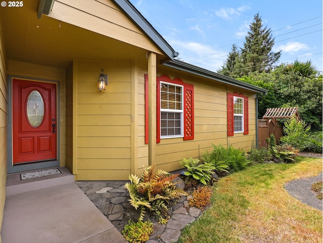 1305 Sandy Ridge Rd, Gearhart, OR 97138 - view of exterior entry with a yard