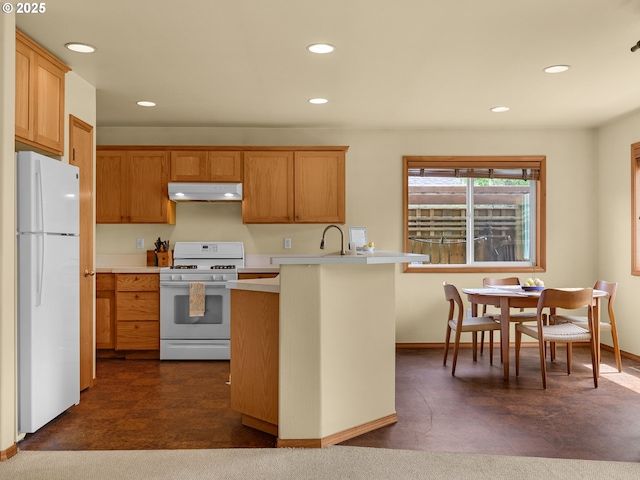 1305 Sandy Ridge Rd, Gearhart, OR 97138 - kitchen with white appliances, under cabinet range hood, light countertops, recessed lighting, and a peninsula