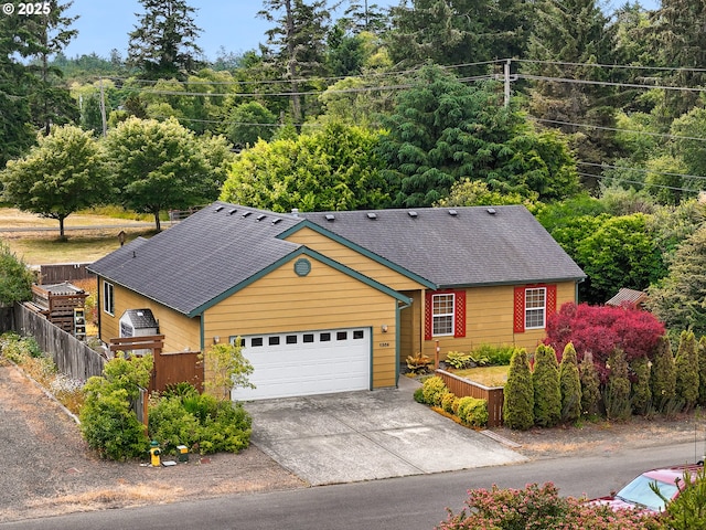 1305 Sandy Ridge Rd, Gearhart, OR 97138 - view of front facade featuring driveway, a garage, and roof with shingles