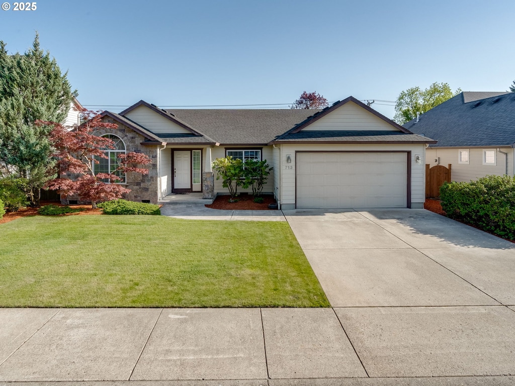 single story home featuring concrete driveway, a shingled roof, a front lawn, and a garage