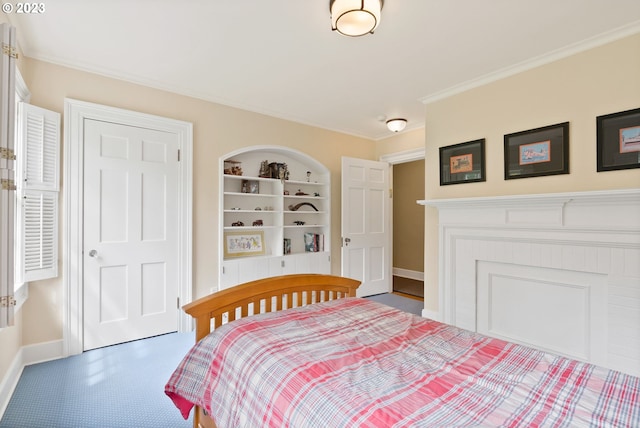 bedroom featuring carpet floors, ornamental molding, and baseboards