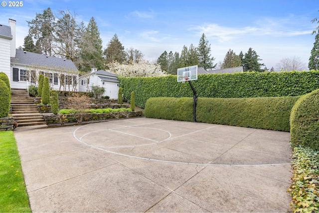 view of sport court with community basketball court and stairs