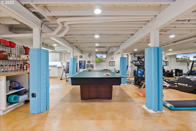 game room featuring concrete flooring