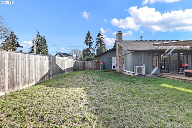 view of yard featuring ac unit and a fenced backyard