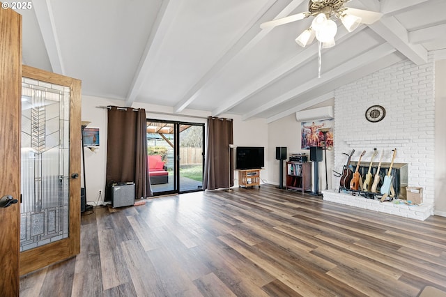 unfurnished living room with vaulted ceiling with beams, a wall mounted air conditioner, wood finished floors, and baseboards