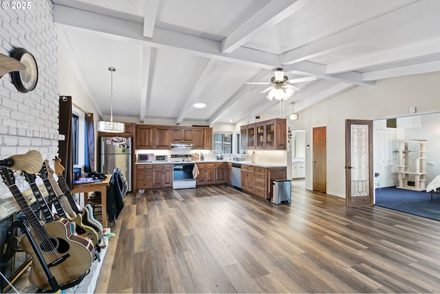 kitchen featuring under cabinet range hood, light countertops, appliances with stainless steel finishes, brown cabinetry, and glass insert cabinets