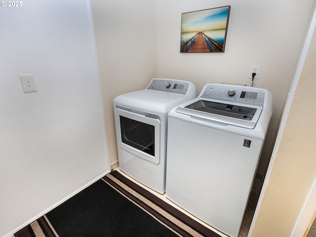 washroom featuring washer and dryer and laundry area