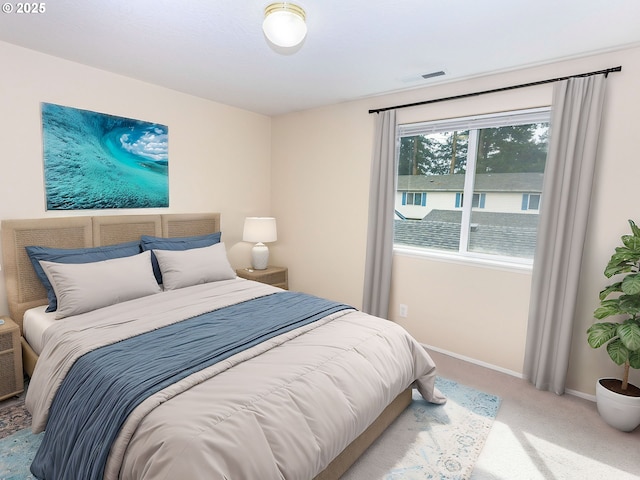 bedroom with visible vents, baseboards, and carpet floors