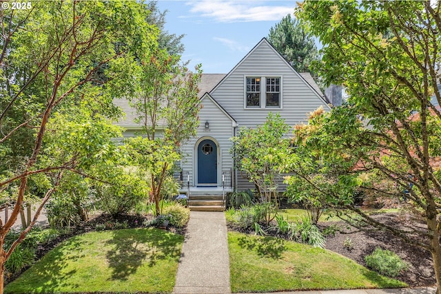 3034 NE Tillamook St, Portland, OR 97212 - view of front of house with a front yard and a shingled roof