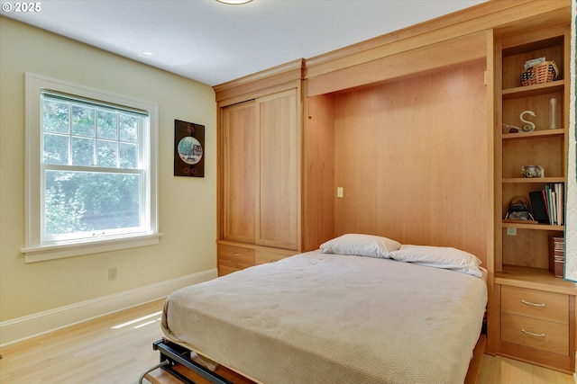 3034 NE Tillamook St, Portland, OR 97212 - bedroom featuring baseboards and light wood-style flooring