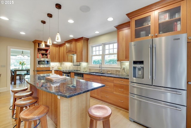 3034 NE Tillamook St, Portland, OR 97212 - kitchen with appliances with stainless steel finishes, decorative backsplash, light wood-type flooring, open shelves, and recessed lighting