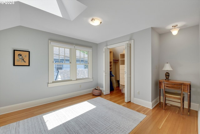 3034 NE Tillamook St, Portland, OR 97212 - bedroom with light wood-style flooring, a skylight, a walk in closet, and a closet