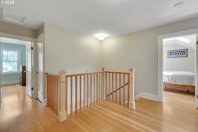 3034 NE Tillamook St, Portland, OR 97212 - hallway featuring an upstairs landing, light wood-style floors, and attic access