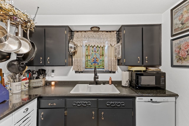 174 Cedar Ln, Gates, OR 97346 - kitchen featuring white dishwasher, black microwave, a sink, and dark countertops