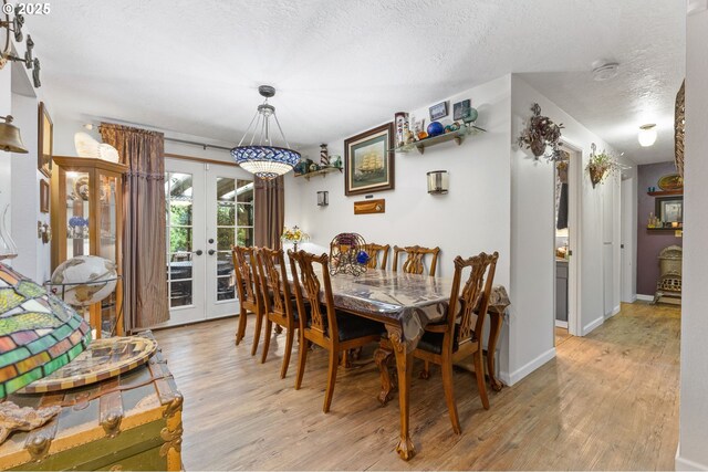 174 Cedar Ln, Gates, OR 97346 - dining area featuring light wood-style flooring, a textured ceiling, and french doors