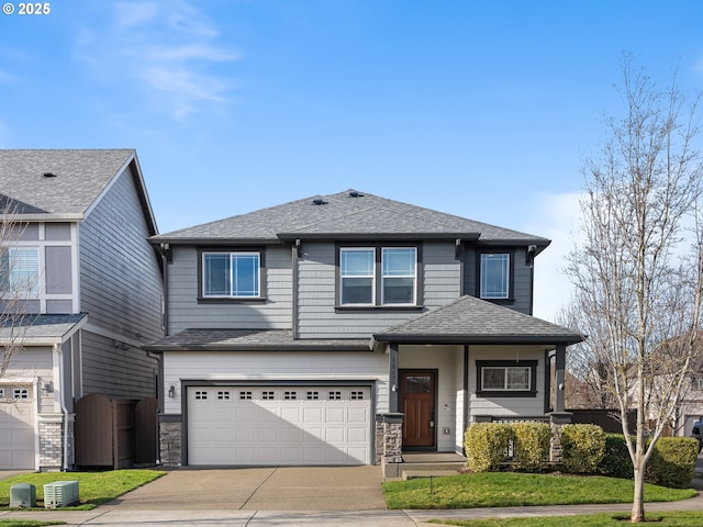 view of front facade with a garage and a front yard