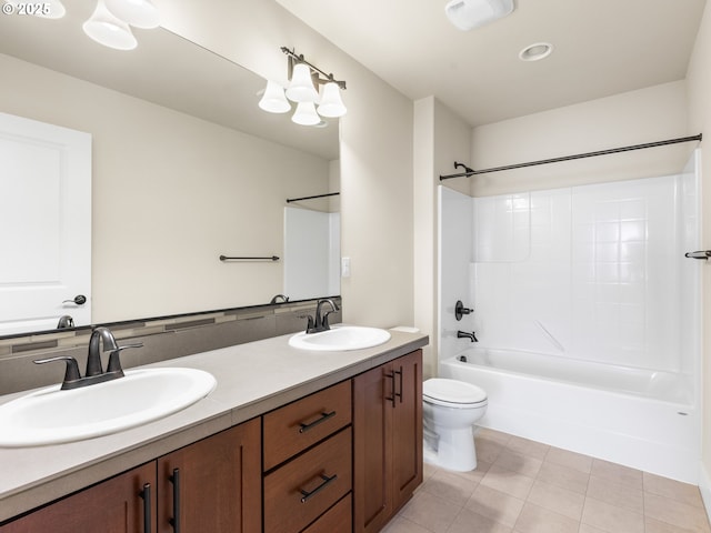 full bathroom with tile patterned flooring, shower / tub combination, vanity, and toilet