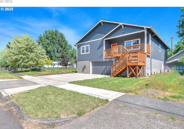 view of front of property with a front lawn, driveway, stairway, covered porch, and a garage